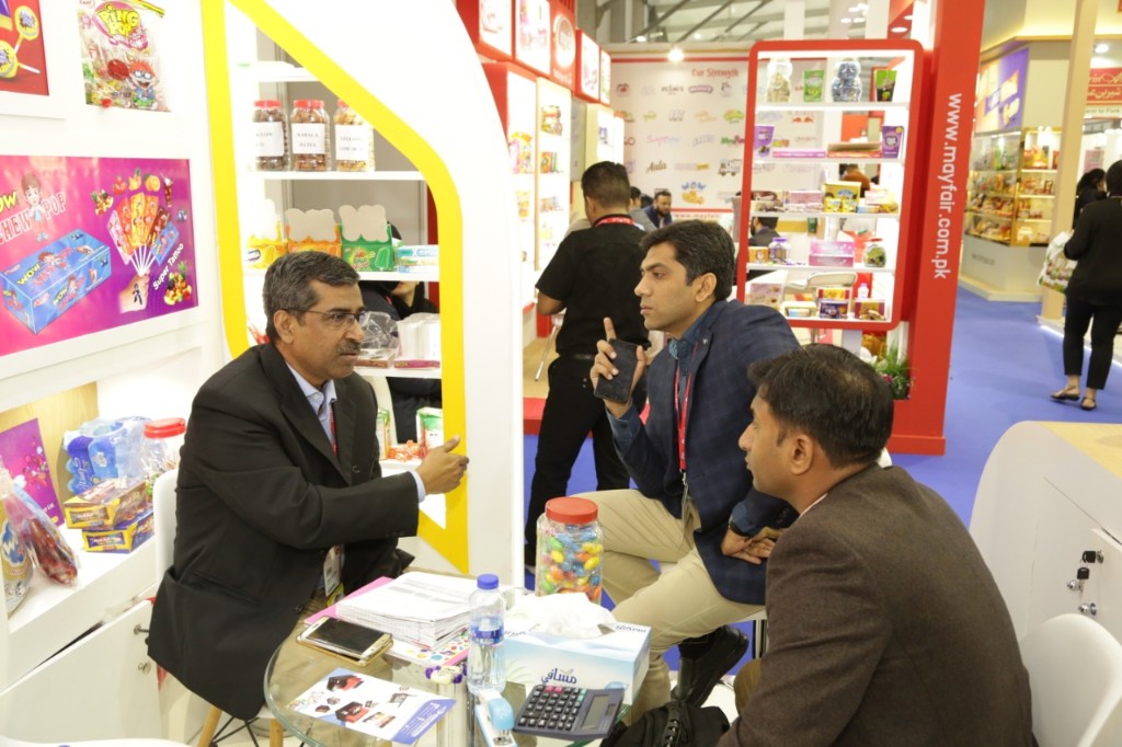 Pearl Confectionery booth at Gulfood Dubai with product displays and business meetings